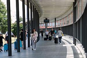 Glass corridor from the station to the airport terminal.