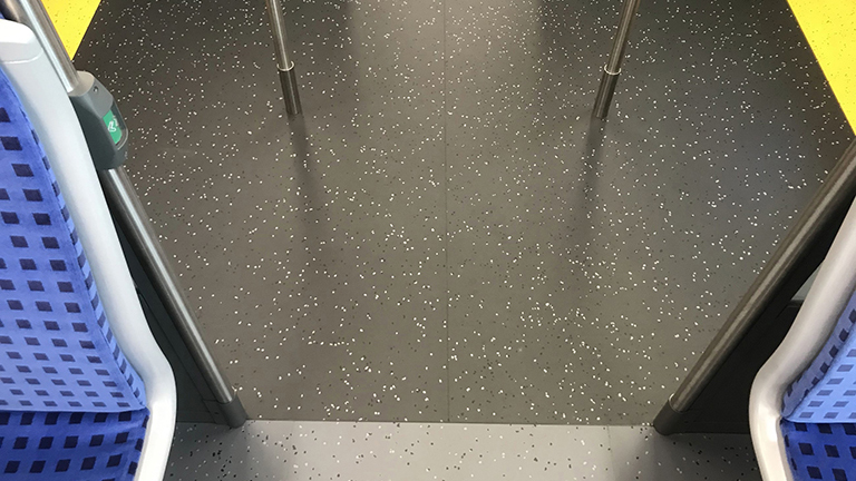 darker flooring near the doors helps passengers with a visual impairment